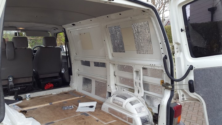 Sound proofing adhered to van panels